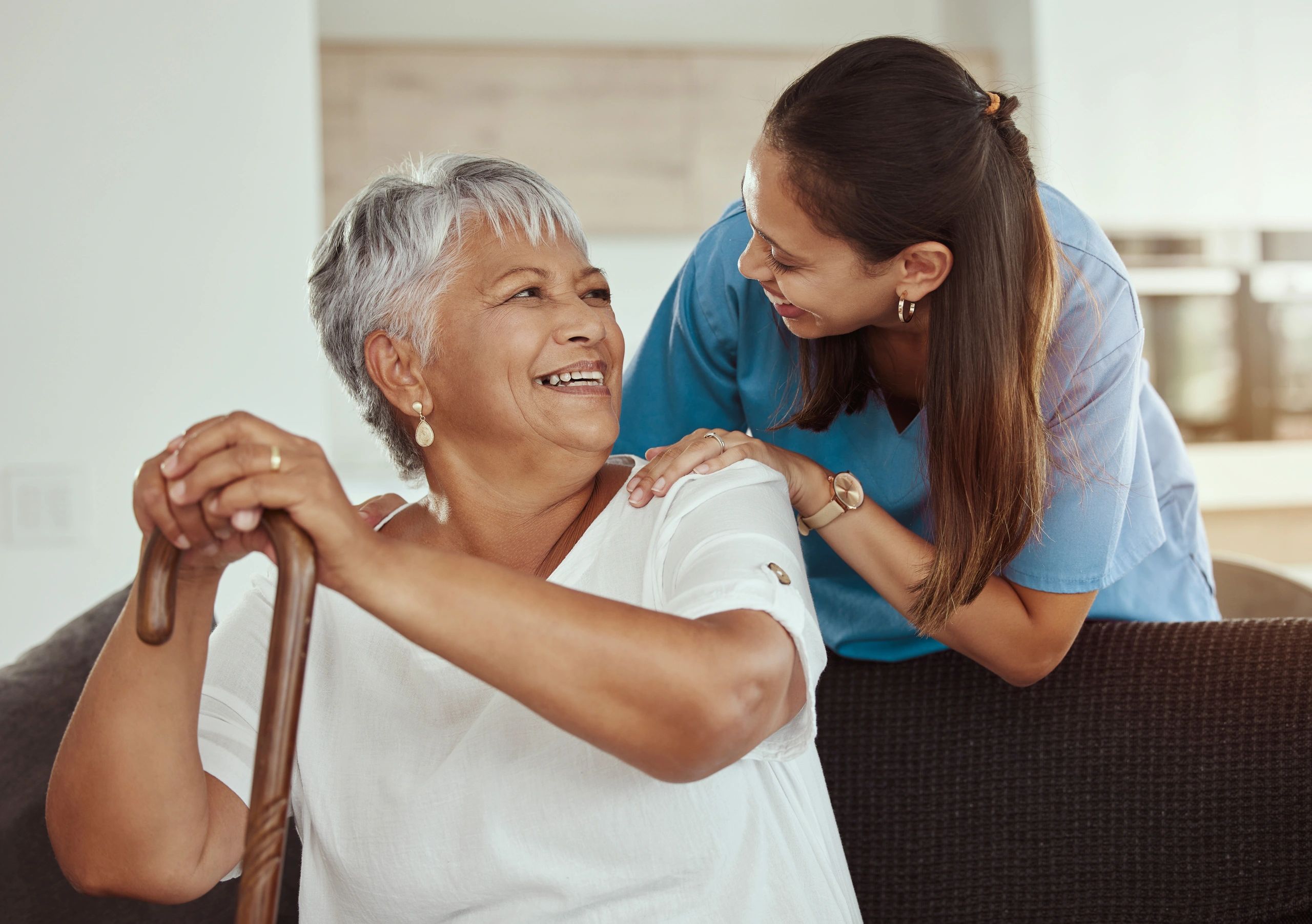 Caregiver assisting elderly patient